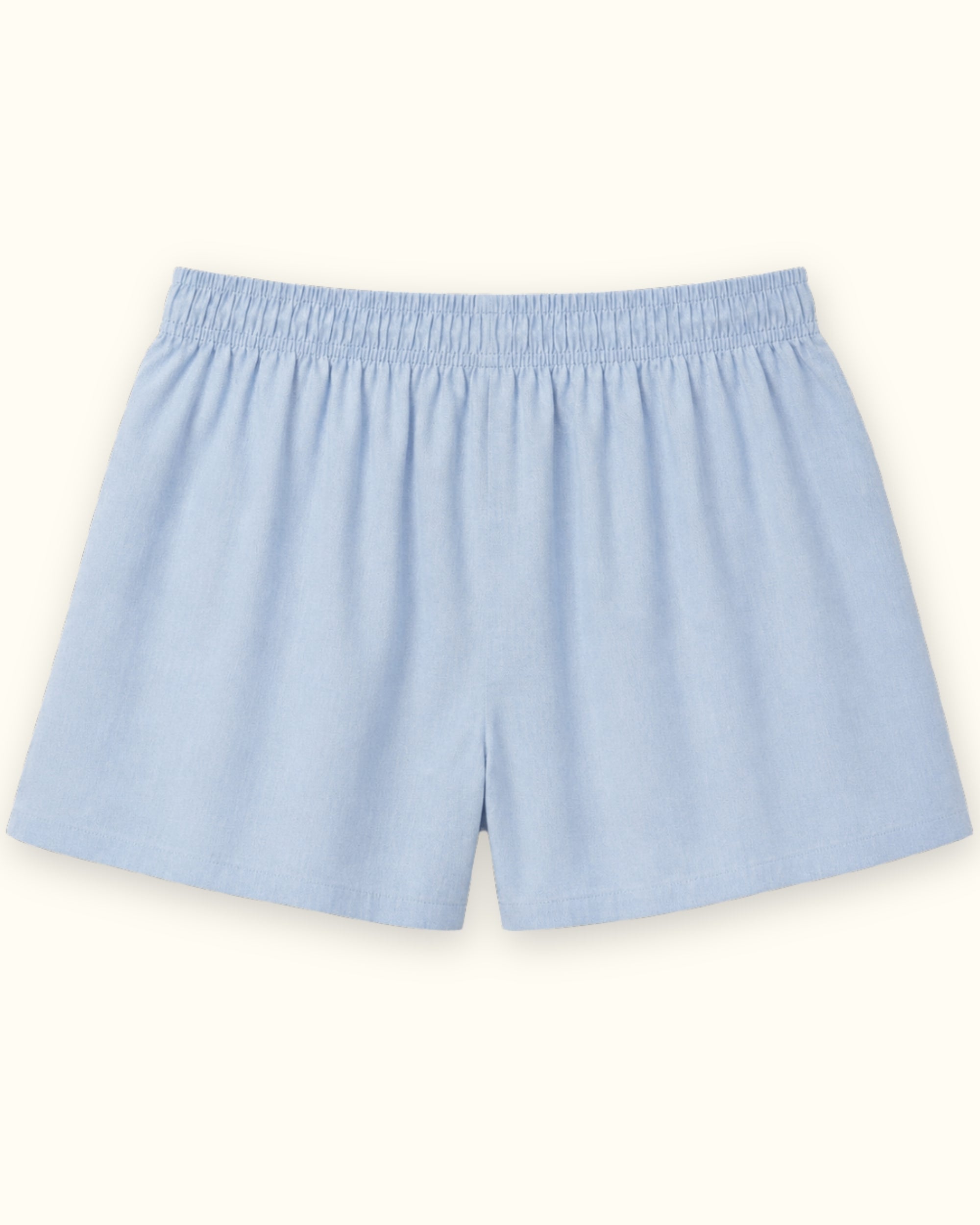 Short boxer en coton bleu clair, vue de dos, montrant la ceinture et la forme de la jambe