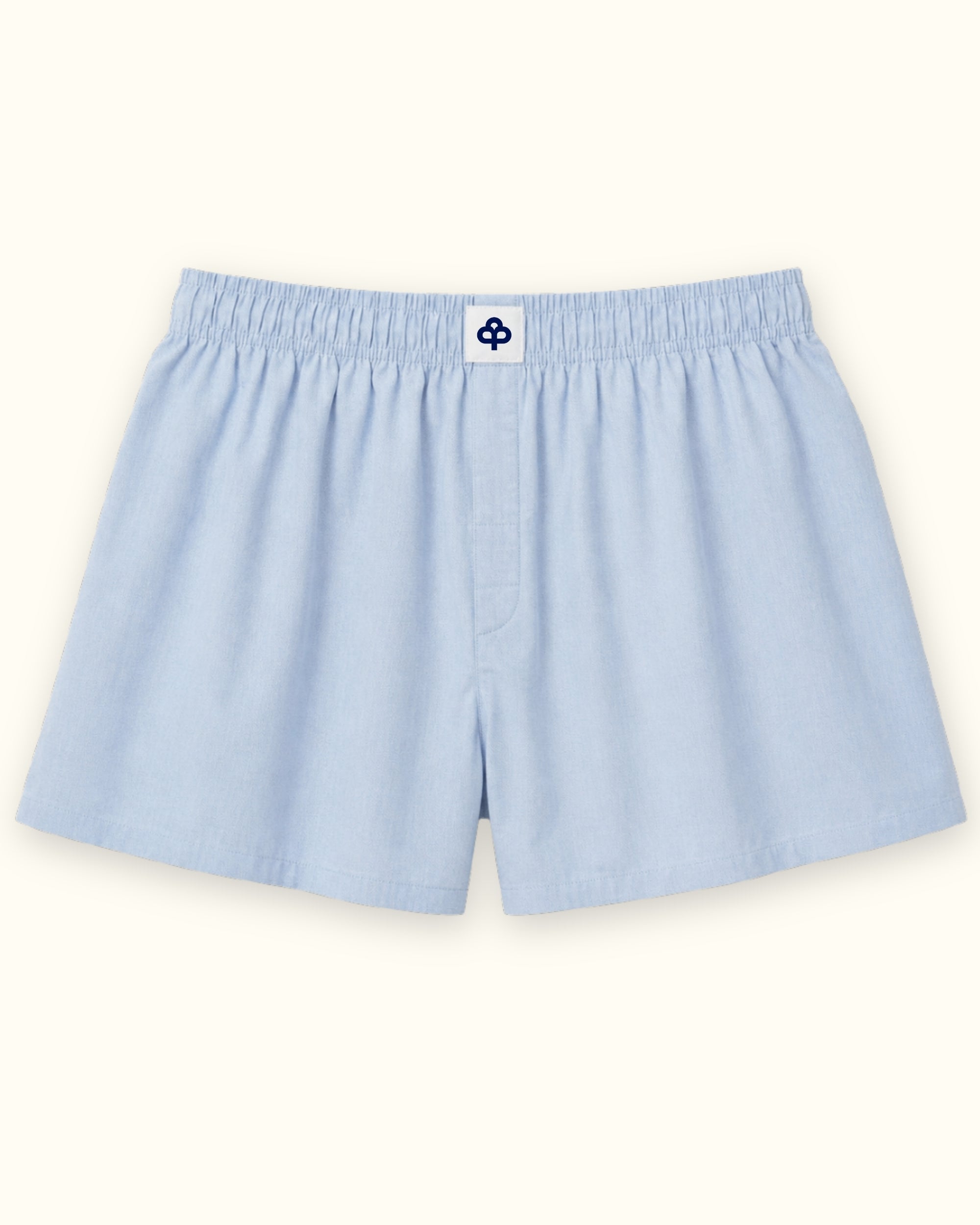 Short boxer en coton bleu clair, vue de face, montrant la ceinture et la forme de la jambe
