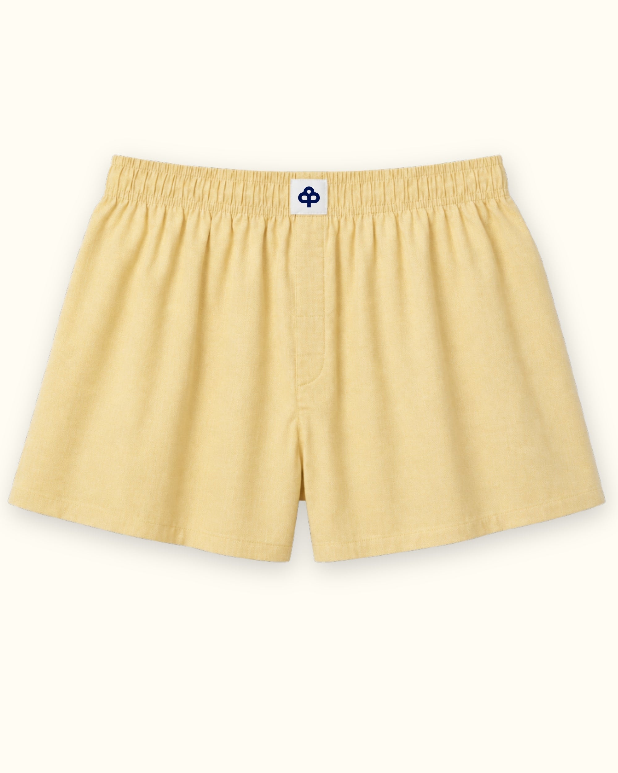 Short boxer en coton jaune clair, vue de face, montrant la ceinture et la forme de la jambe