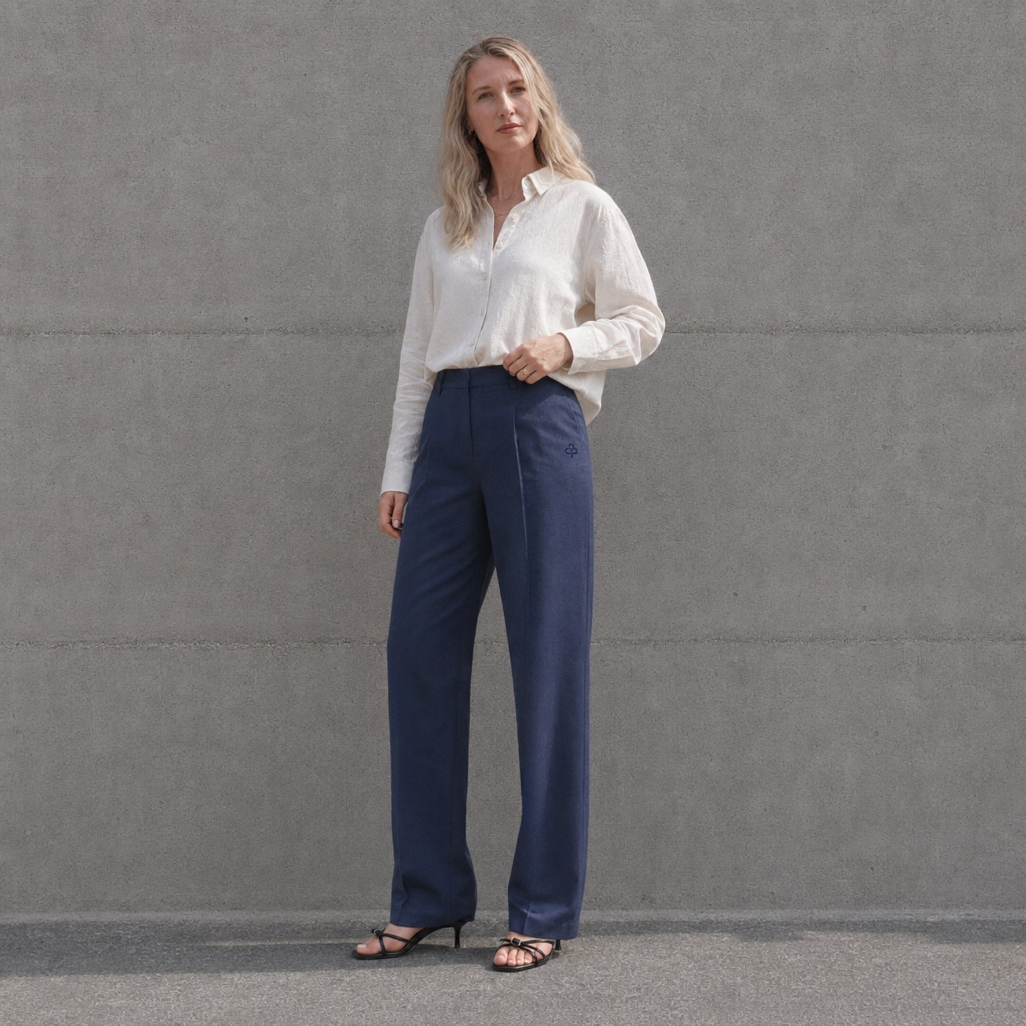 Straight Leg Linen Pants in Navy Blue, lifestyle view 1, showing pleats and straight leg shape