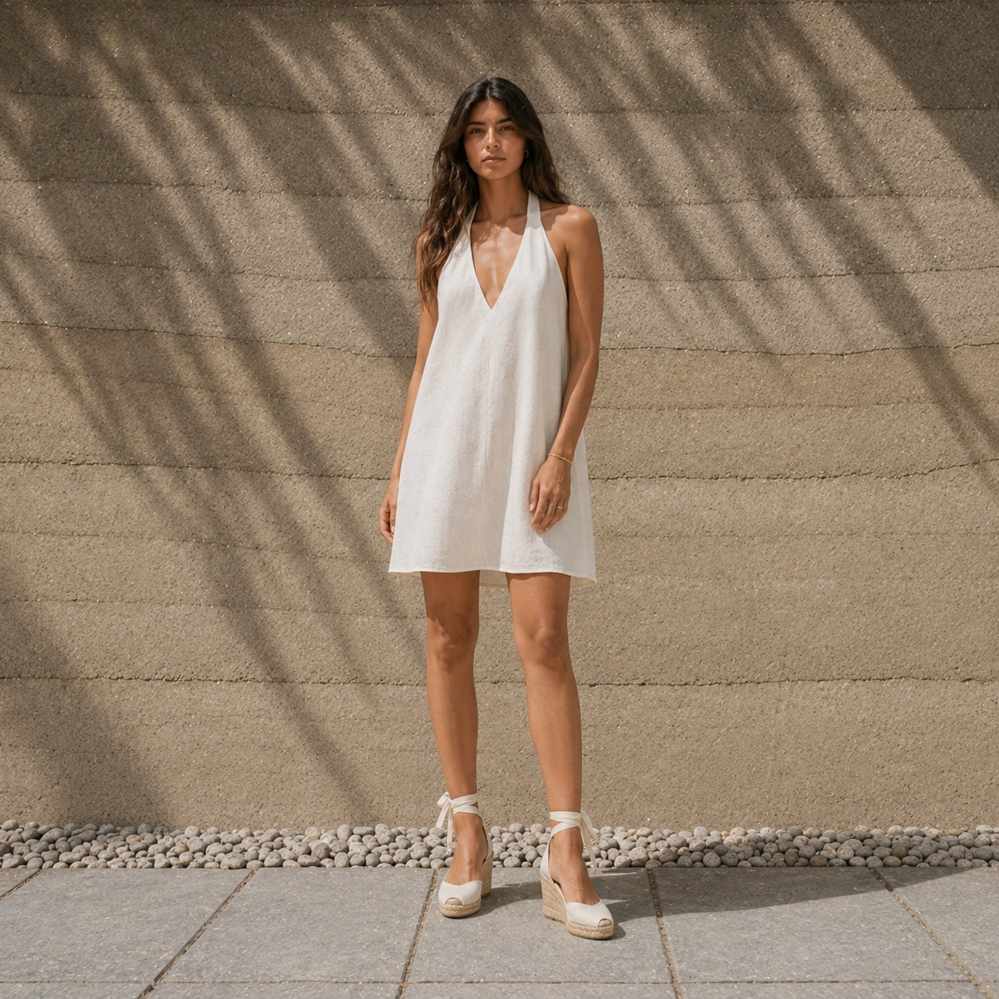 Linen Halter Dress in Off White, lifestyle view 1, showing neckline and dress silhouette