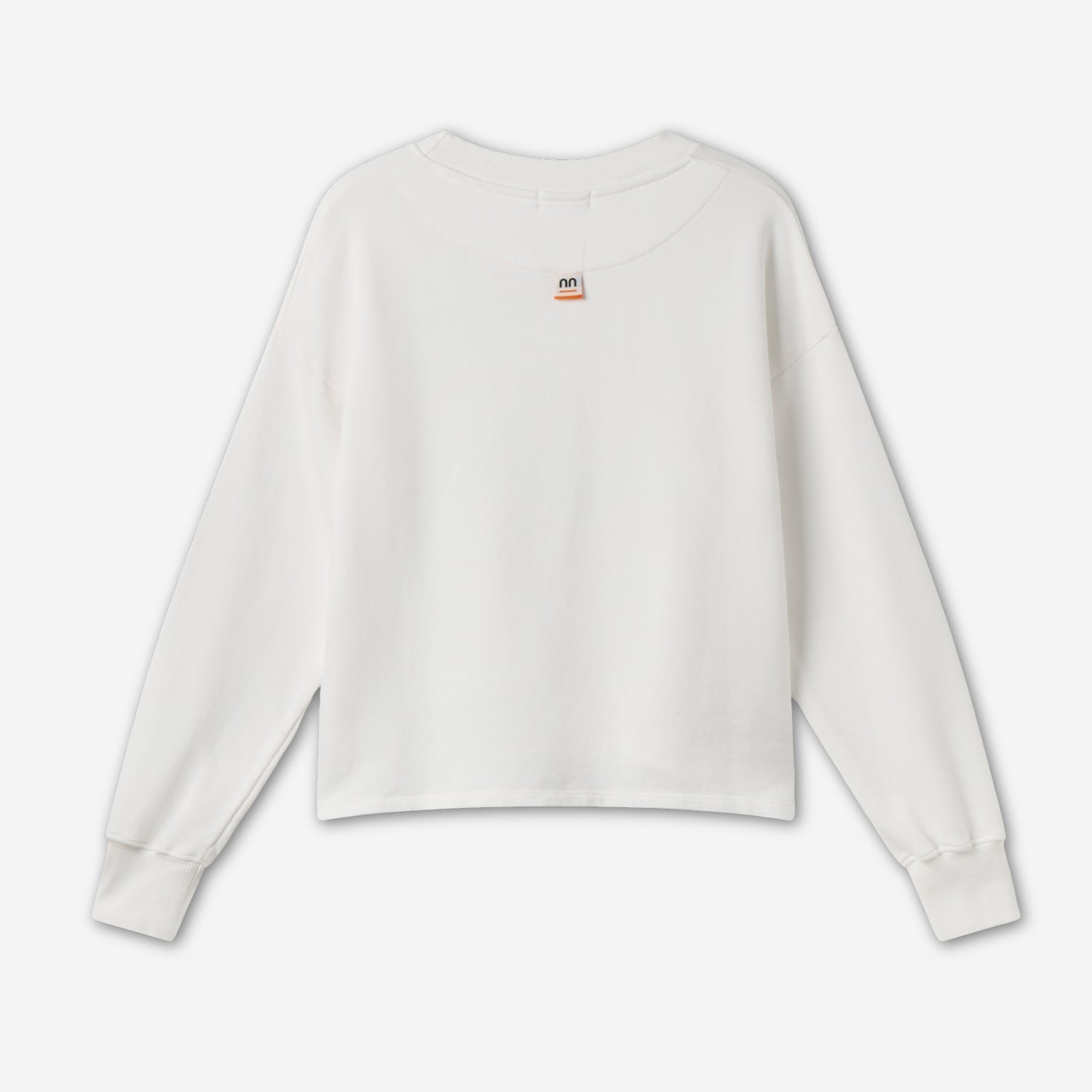 White women crewneck back showing Pamuuc isotope woven label