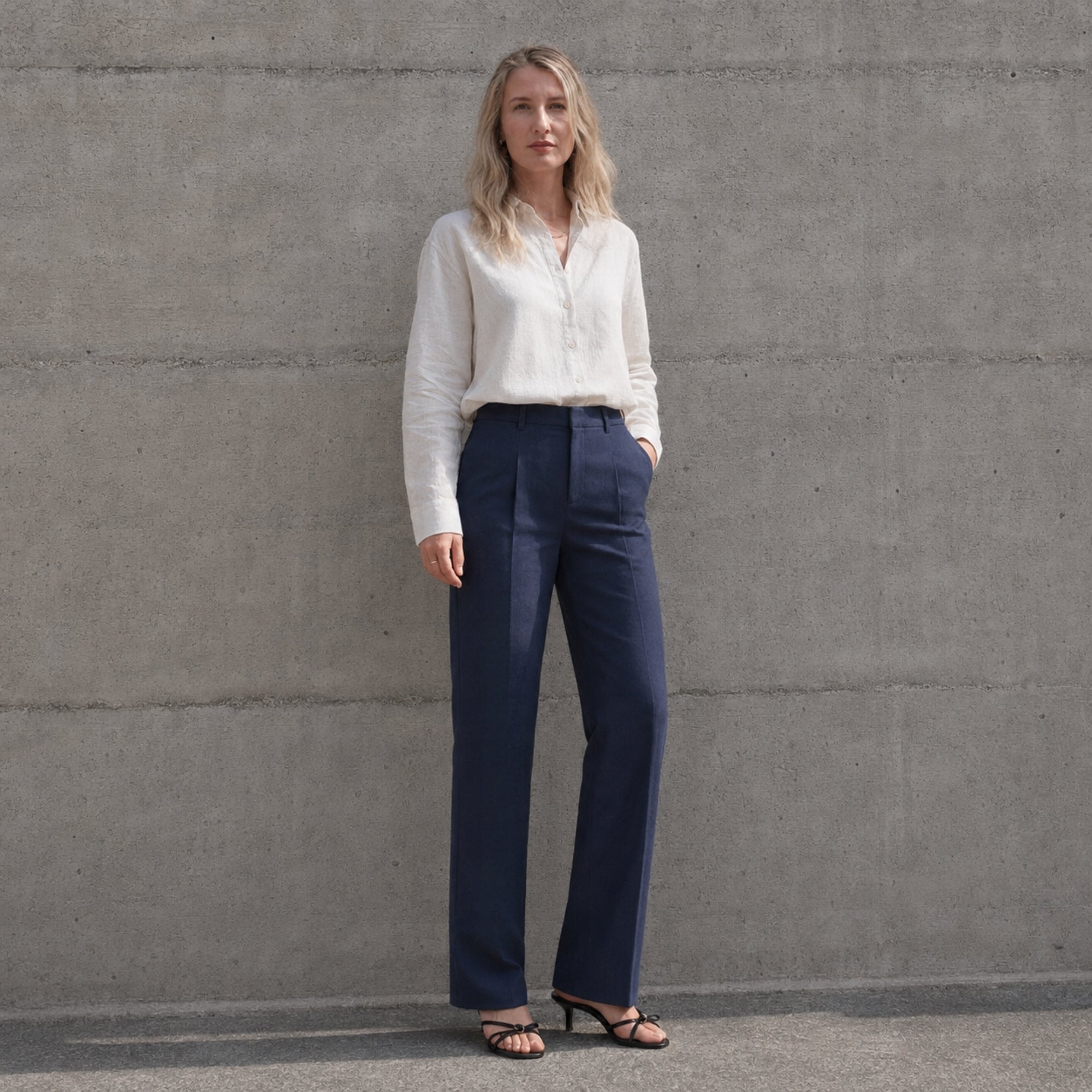 Straight Leg Linen Pants in Navy Blue, lifestyle view 2, showing pleats and straight leg shape